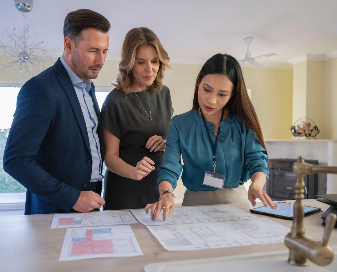 Team analyzing floor plans together