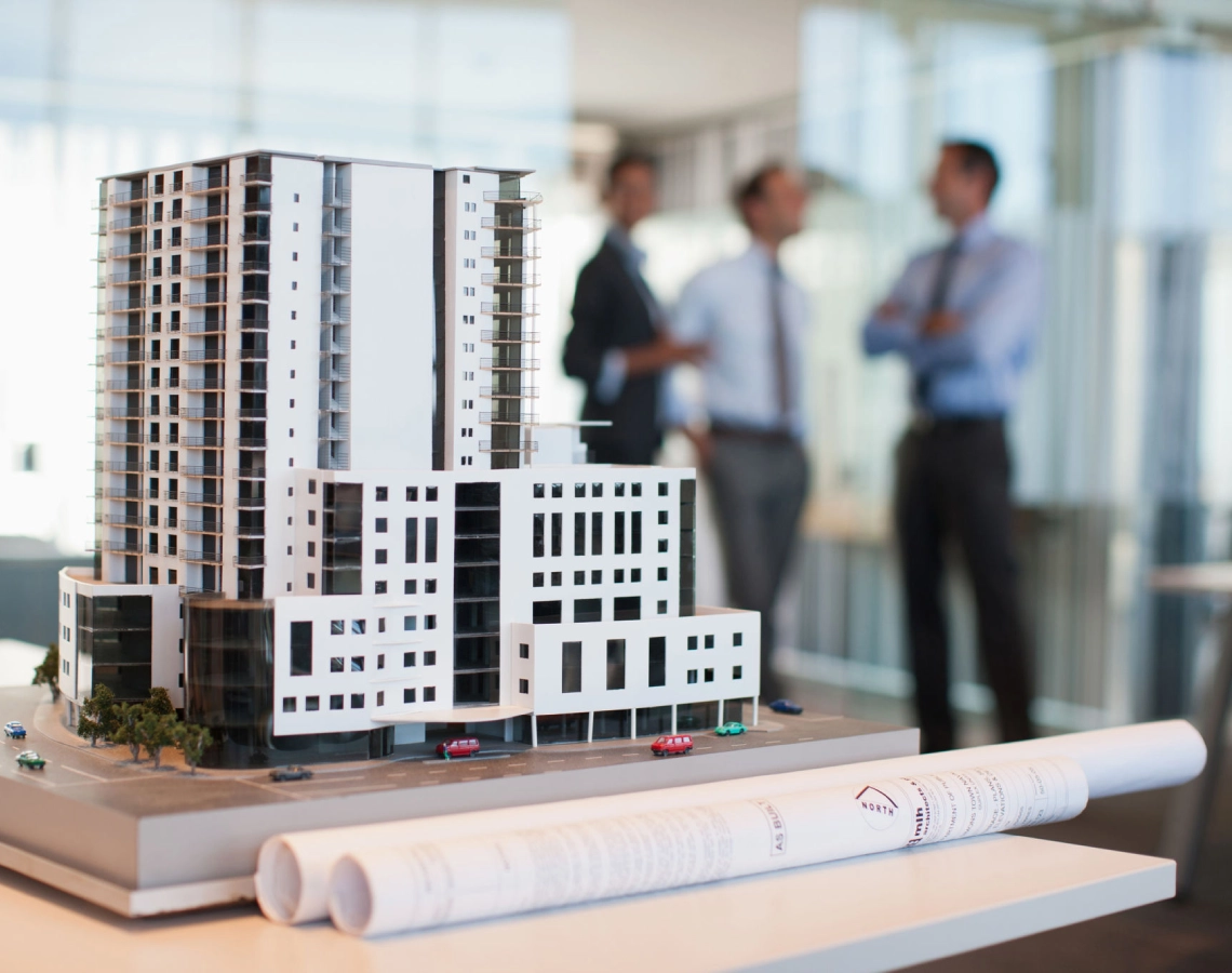Architectural model with business professionals