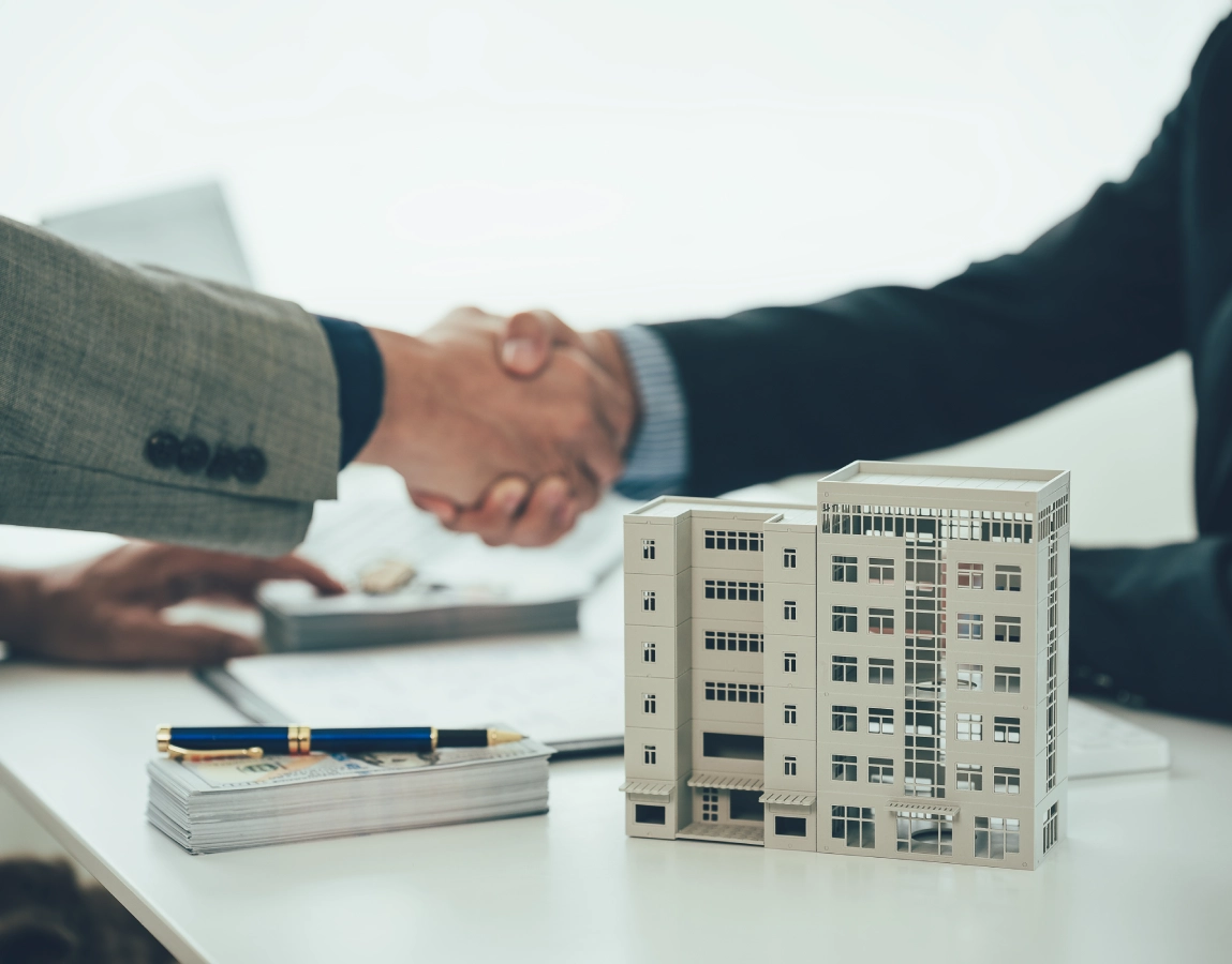 Property contract signing handshake