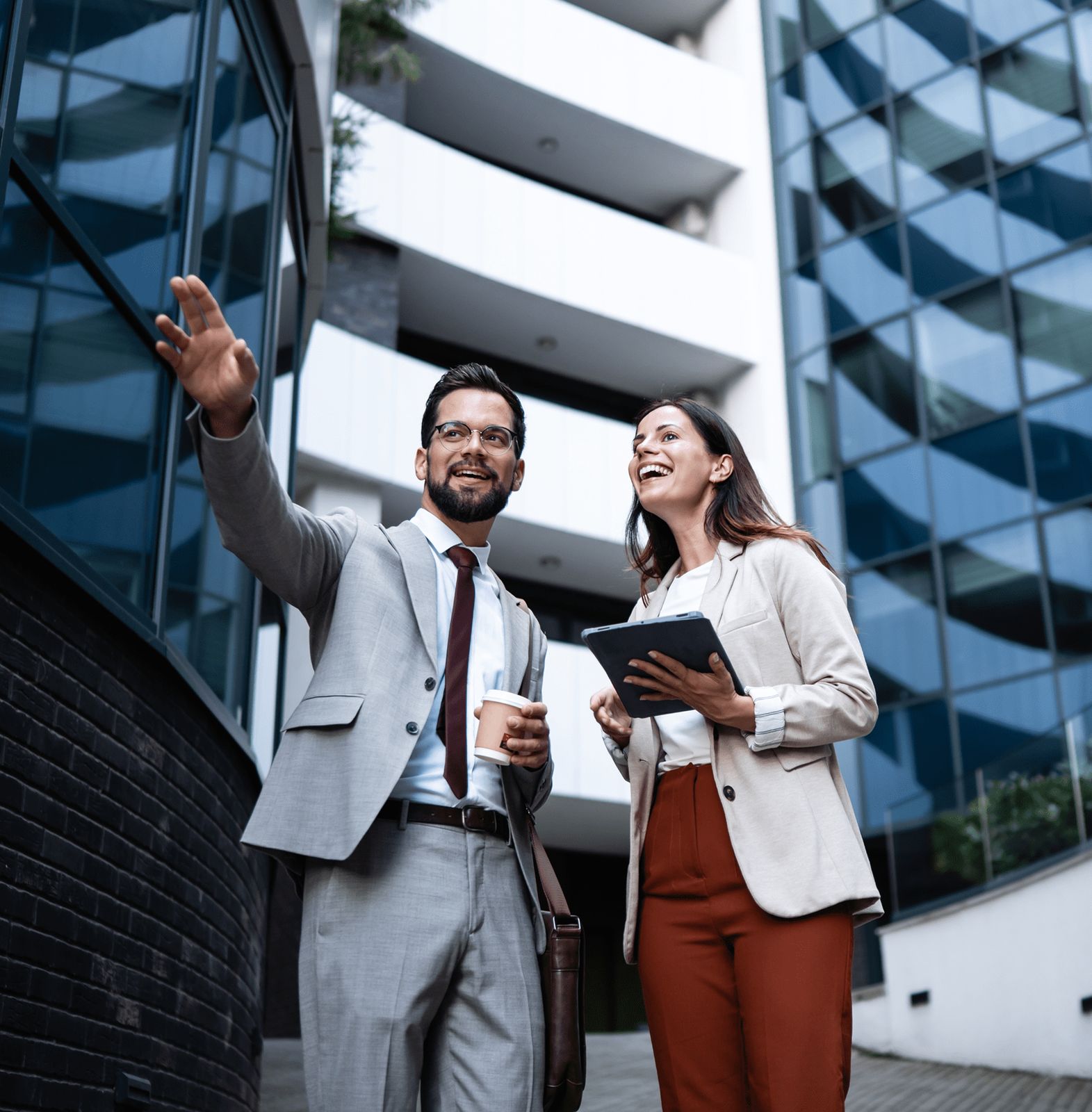 Business colleagues discussing outside modern building